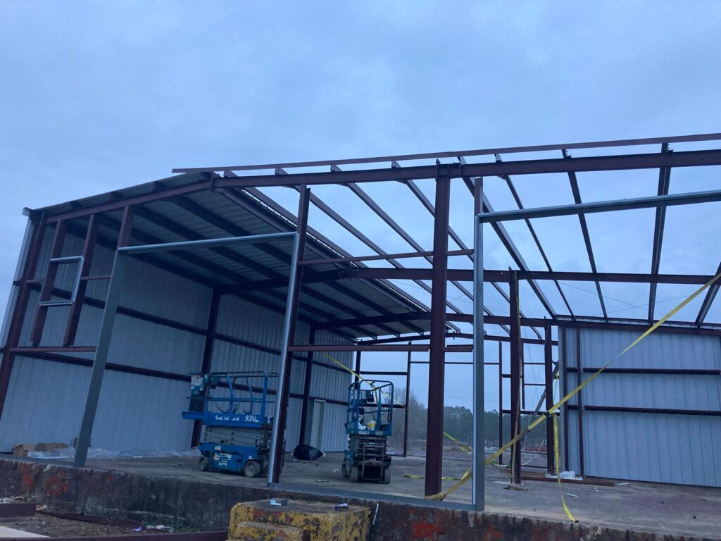 What is the cost breakdown of hiring metal building erectors?